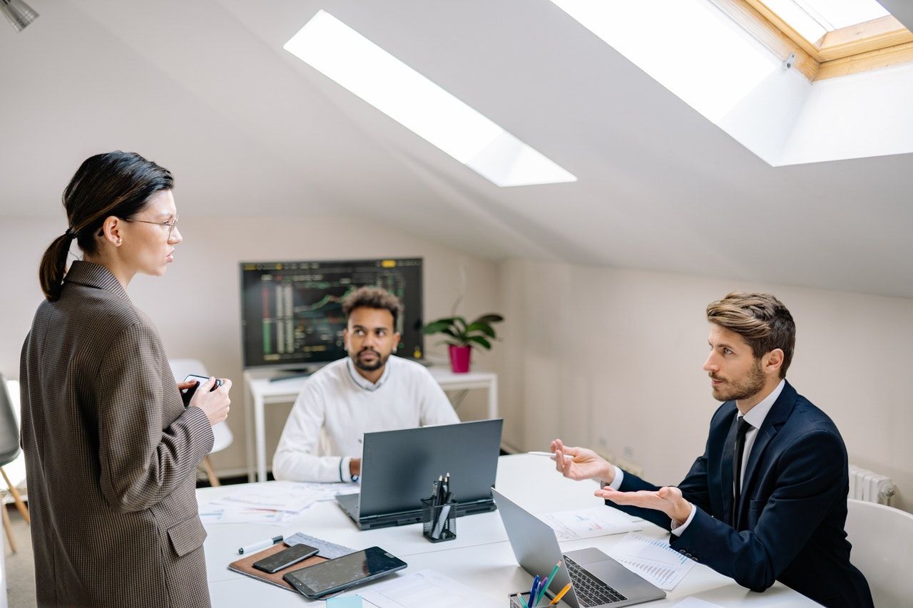 A group of employee working together around a table.