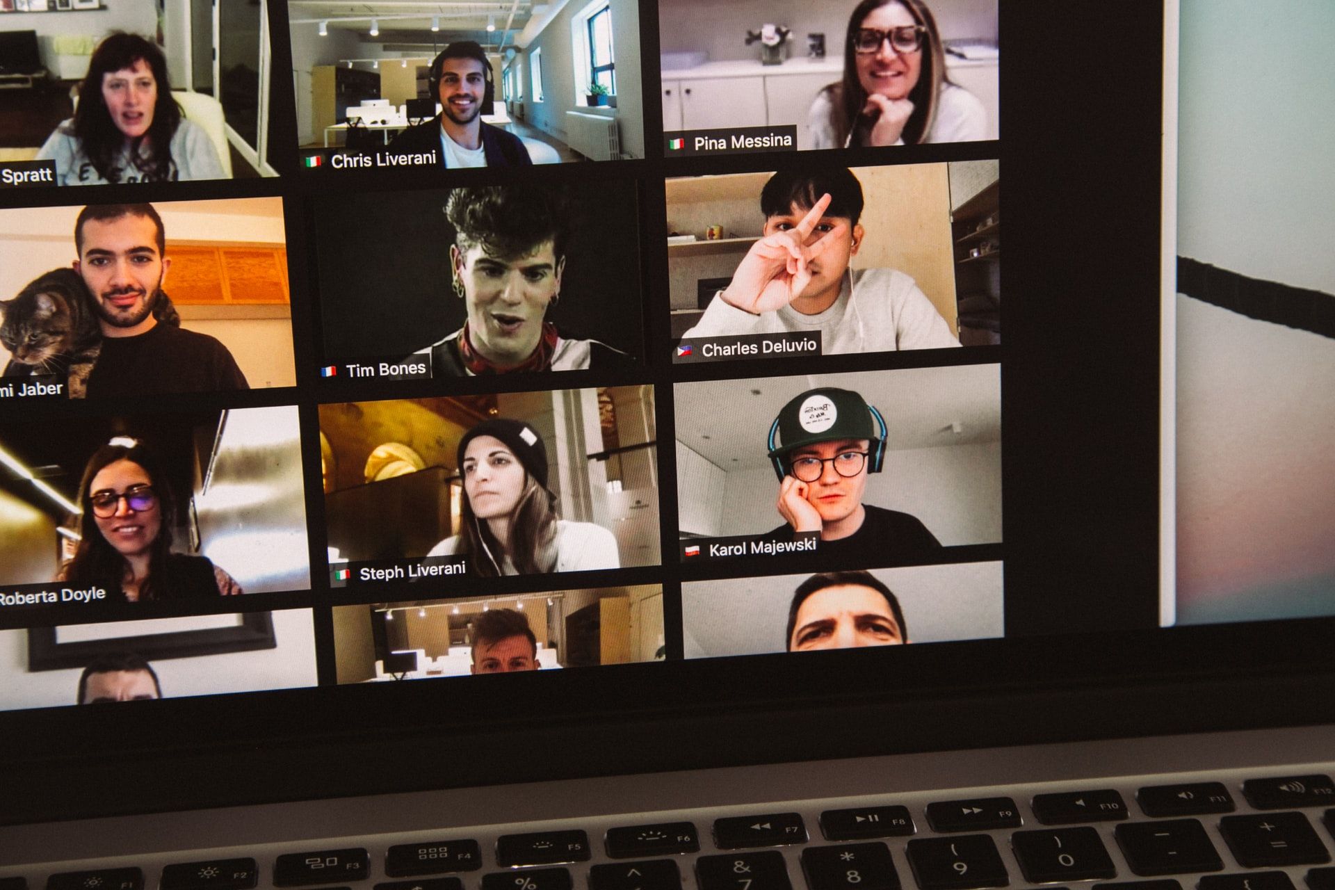 A shot of a Zoom video call between an eclectic group of remote workers.